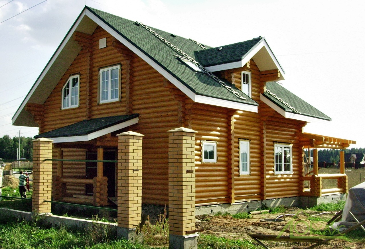 Дом из оцилиндрованного бревна по индивидуальному проекту